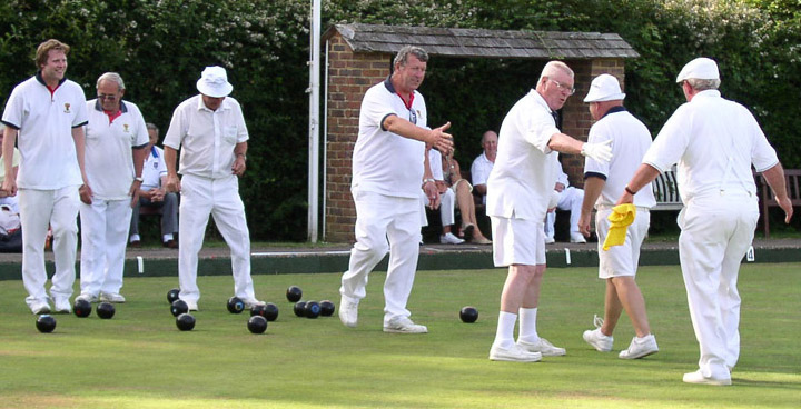 The winning Buxted team shaking hands with the losing finalists